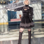@trashbunnii as 2B from NieR: Automata with a massive greatsword at Anime NYC 2025 Javits Center – animenyc.com.
