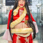 @silmwil cosplaying Boa Hancock from One Piece with a snake prop at Anime NYC 2025 Javits Center – animenyc.com.