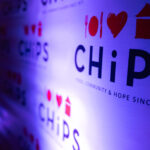 CHiPS logo banner illuminated by purple lighting at the 2025 Annual Gala in Park Slope, Brooklyn.
