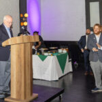 Marc Gordon speaks at a podium while attendees applaud during the 2025 CHiPS Annual Gala at 501 Union in Park Slope, Brooklyn.