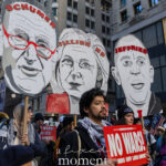 Protesters carrying effigies of Schumer, Gillibrand, and Jeffries during the Hands Off protest in Midtown Manhattan on January 11, 2026.