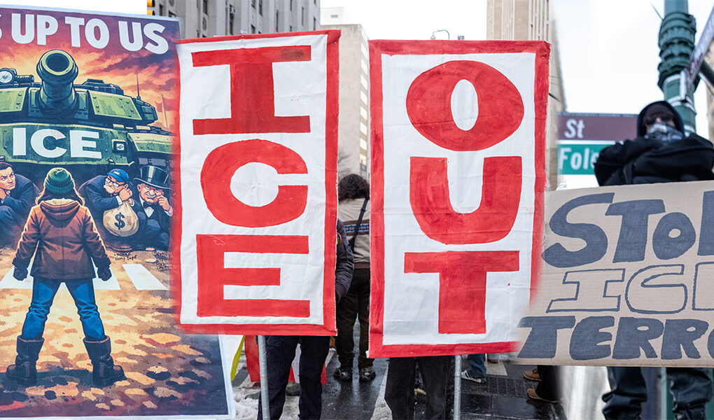 Large red ICE OUT banners and a Stop ICE Terror sign held by protesters during National Shutdown Day demonstration in Lower Manhattan, New York City.