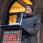 New York State Attorney General Letitia James speaks at a podium during The People’s Filibuster outside The Public Theater in Manhattan.