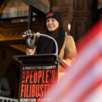 Laura Benanti speaks at a podium during The People’s Filibuster outside The Public Theater in New York City.