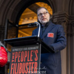 New York City Comptroller Mark Levine speaks at a podium during The People’s Filibuster outside The Public Theater in Manhattan.