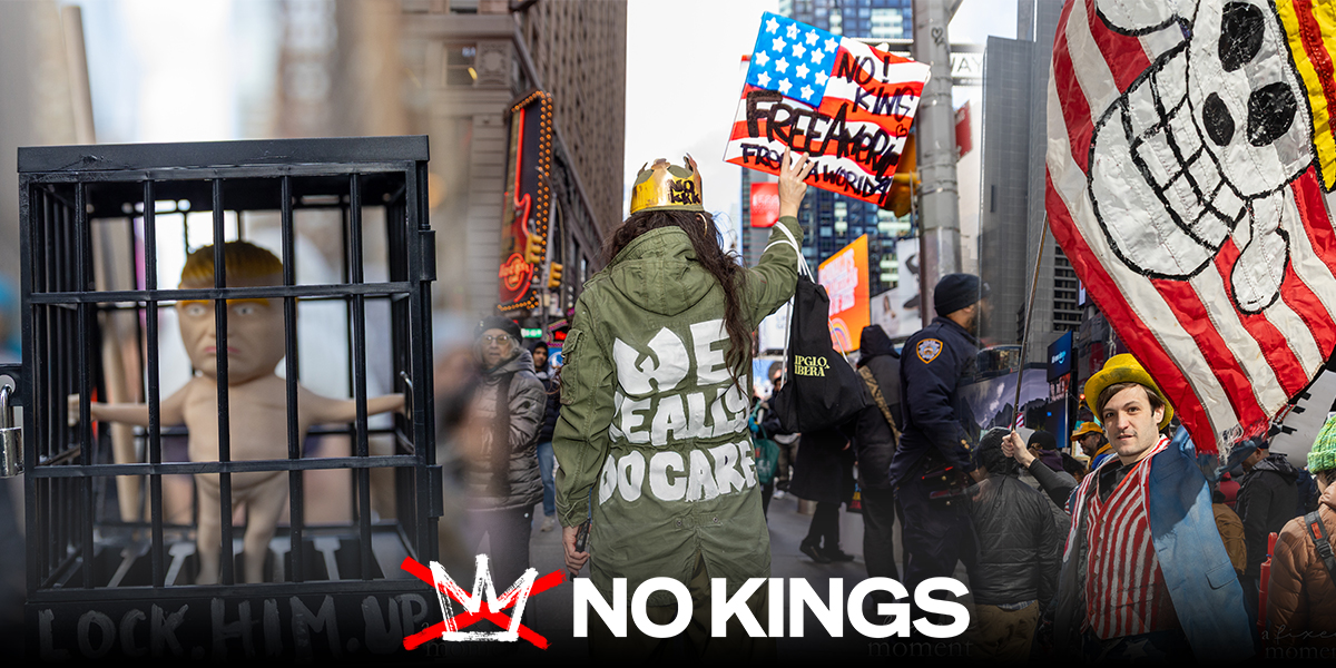 A protester seen from behind wears a green jacket with the words “We Eat, Do Care” and holds a sign above their head in Times Square.