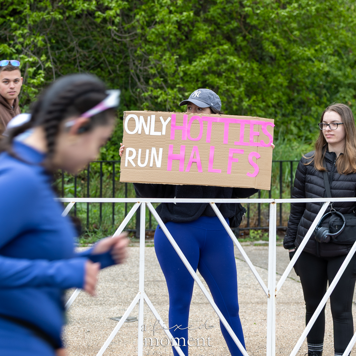 Spectator holds an Only hotties run halfs sign