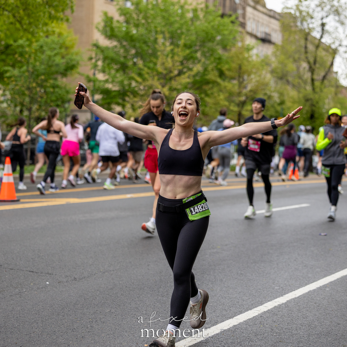 Runner celebrates with arms wide