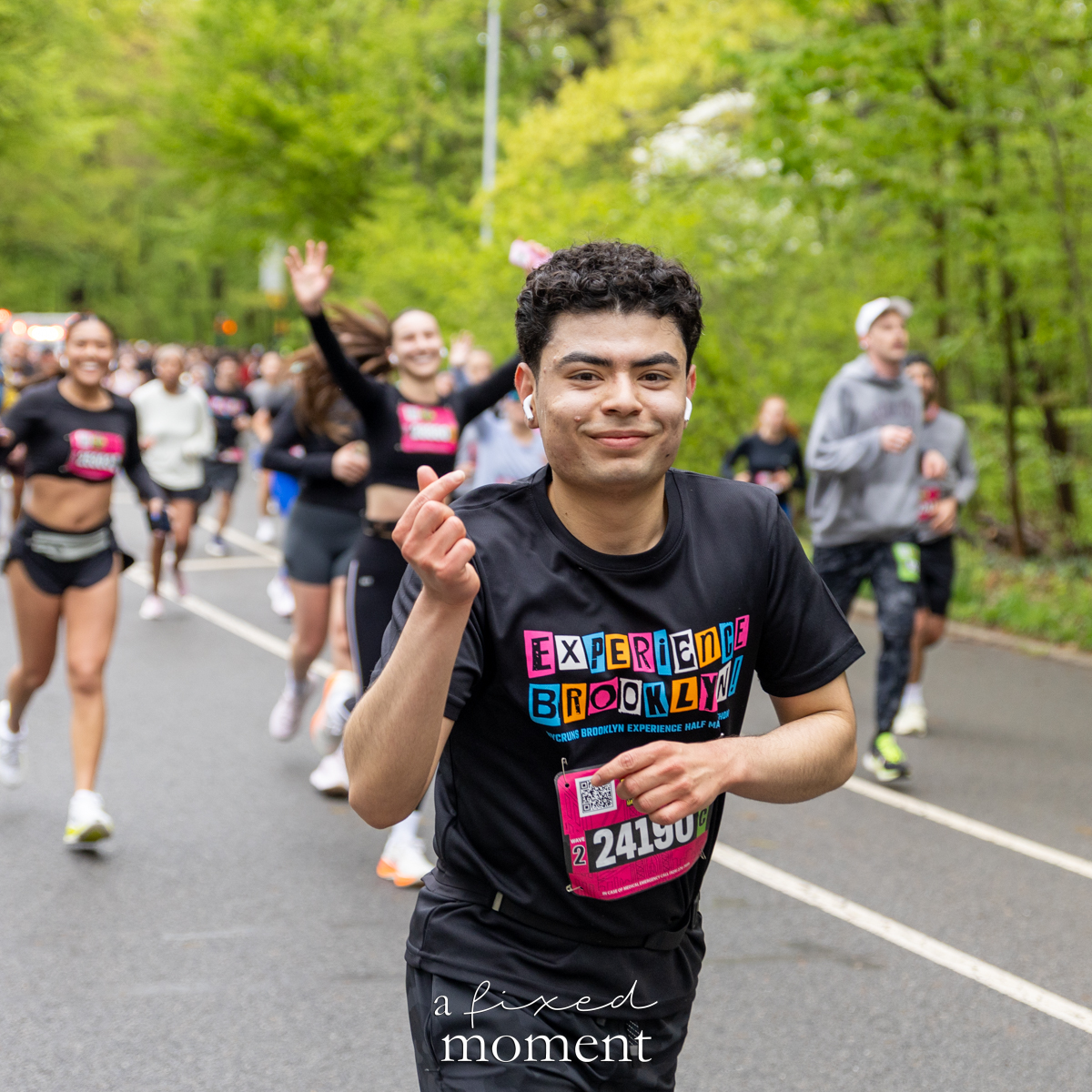 Runner makes a finger heart gesture