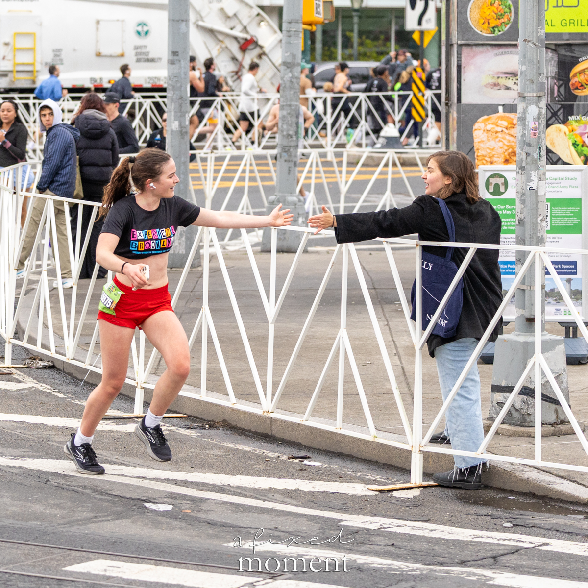Runner high-fives a spectator