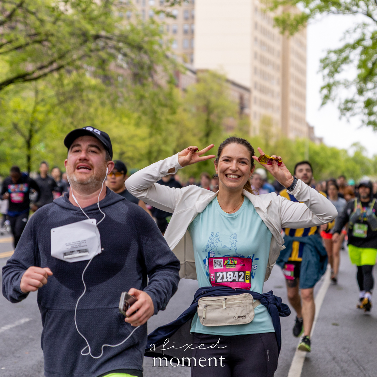 Runner smiles and gives a peace sign during the Brooklyn Experience Half Marathon