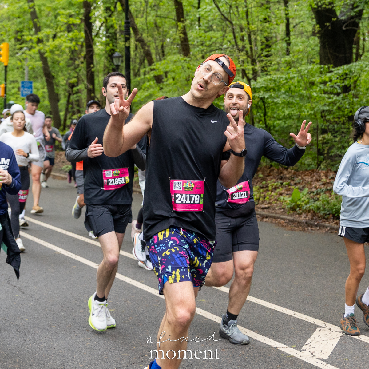 Runners give peace signs
