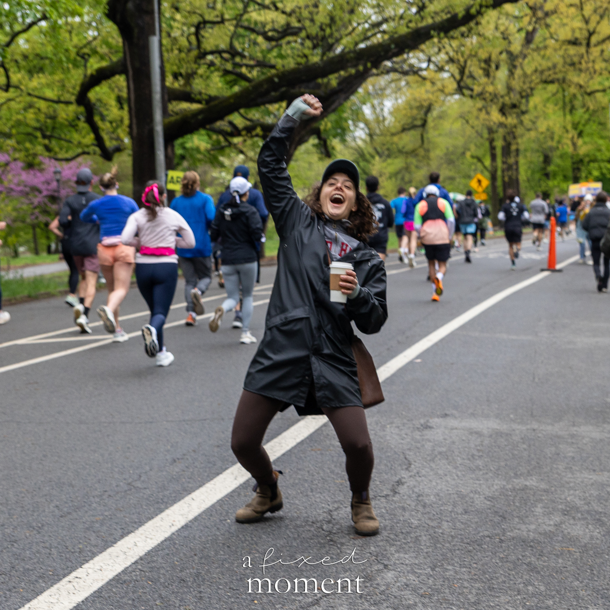 Spectator cheers with coffee during the race