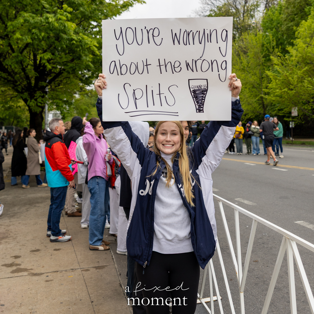 Spectator holds a wrong splits sign