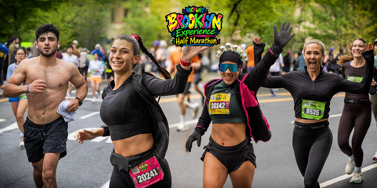 Runners smile, wave, and move through the Brooklyn Experience Half Marathon in Brooklyn, NYC, on April 26, 2026.