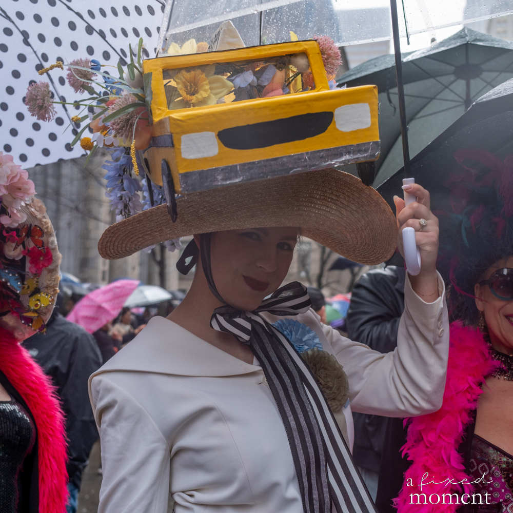 Participant wearing a yellow taxi themed hat at the Easter Parade and Bonnet Festival.