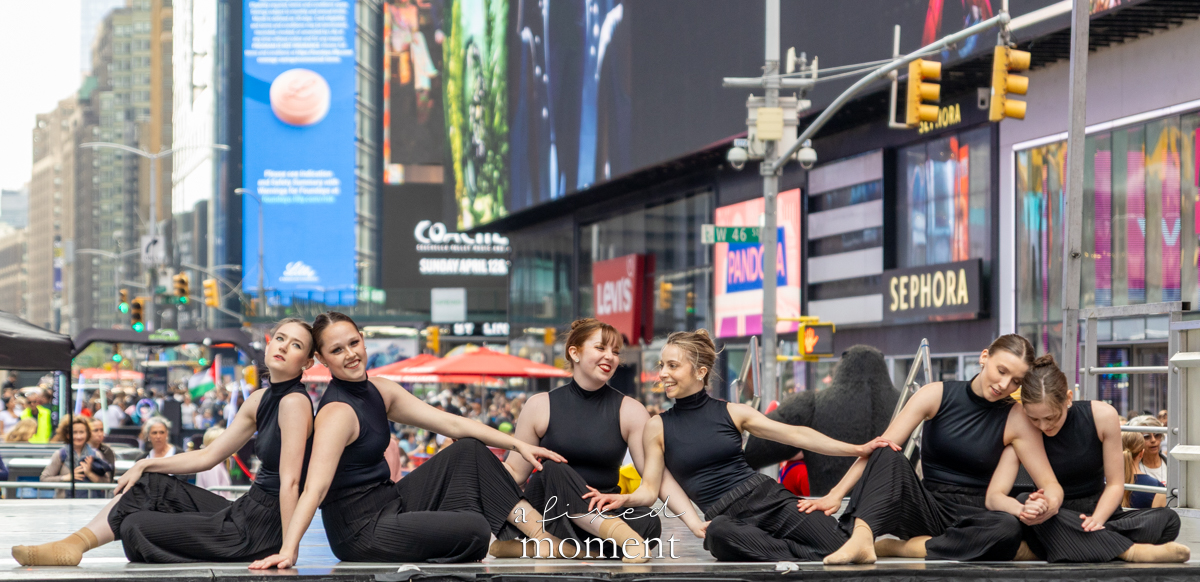 Project Dance black costume seated ensemble