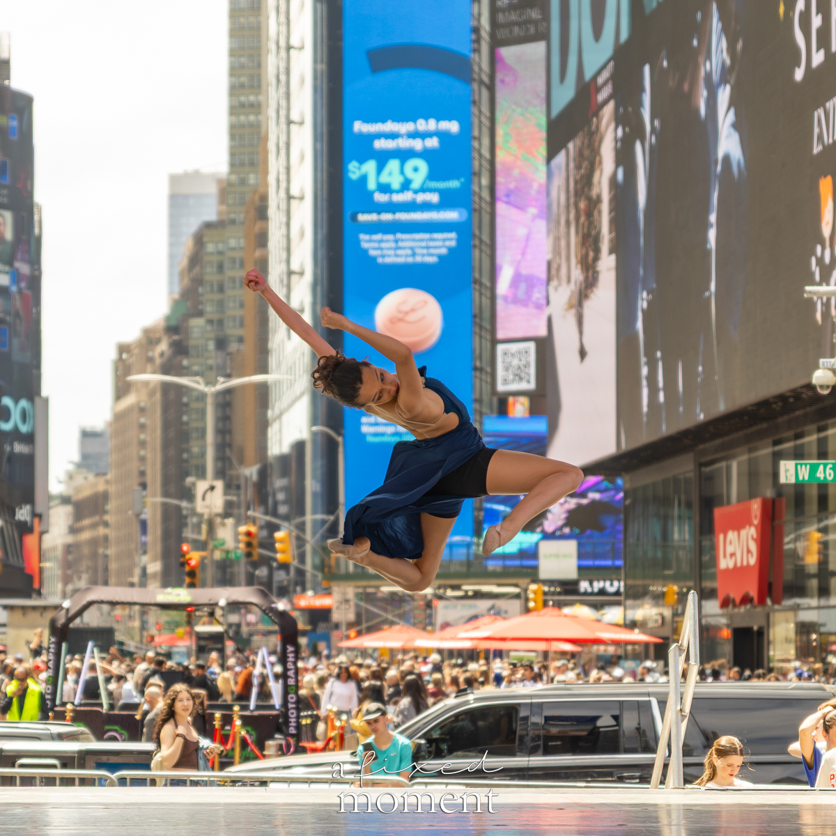 Project Dance dancer midair jump in blue dress