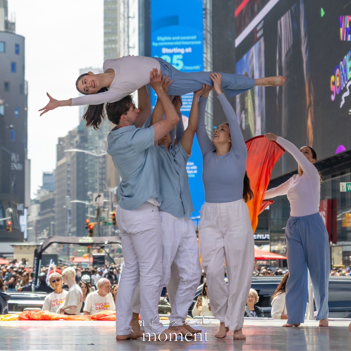 Project Dance dancers lift a figure on stage
