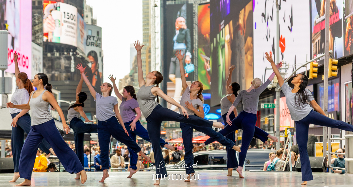 Project Dance ensemble dancers with arms raised