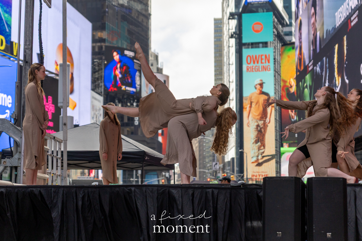 Project Dance group lift in neutral costumes