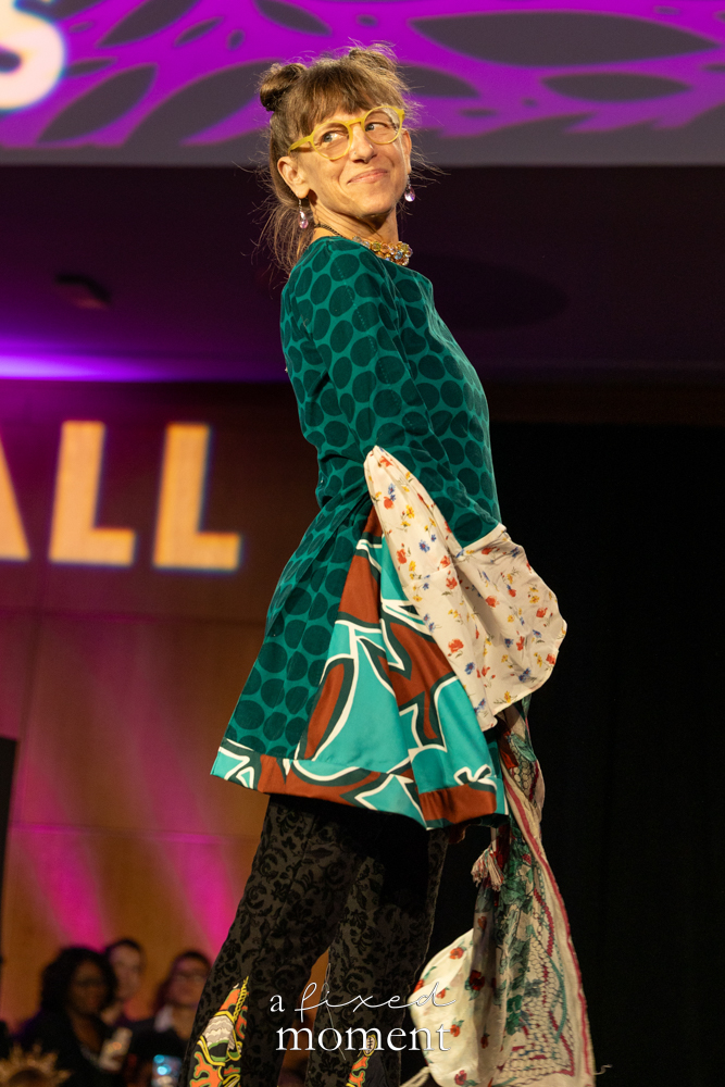 Participant in a green patterned runway look at Brooklyn's 2026 People's Ball