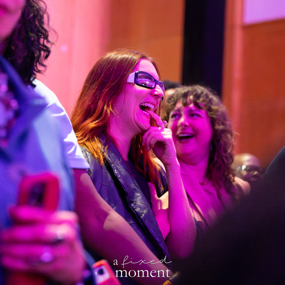 Audience reacts under magenta lighting during Brooklyn's 2026 People's Ball