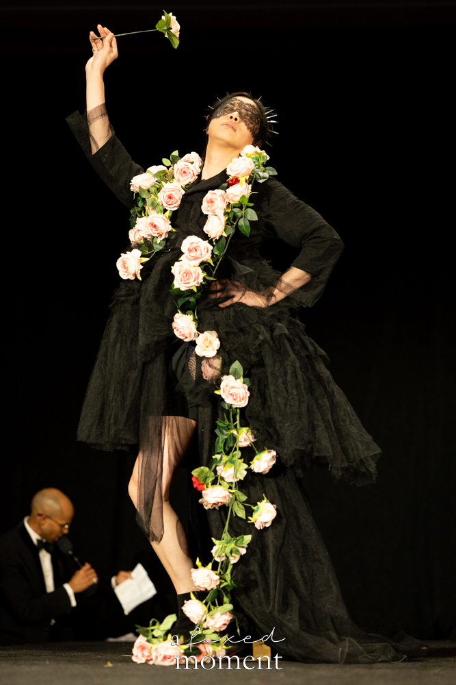 Participant in a black tulle and rose vine runway look at Brooklyn's 2026 People's Ball