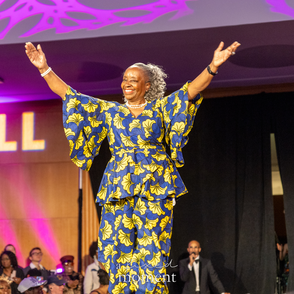 Participant in a blue and yellow floral runway look at Brooklyn's 2026 People's Ball