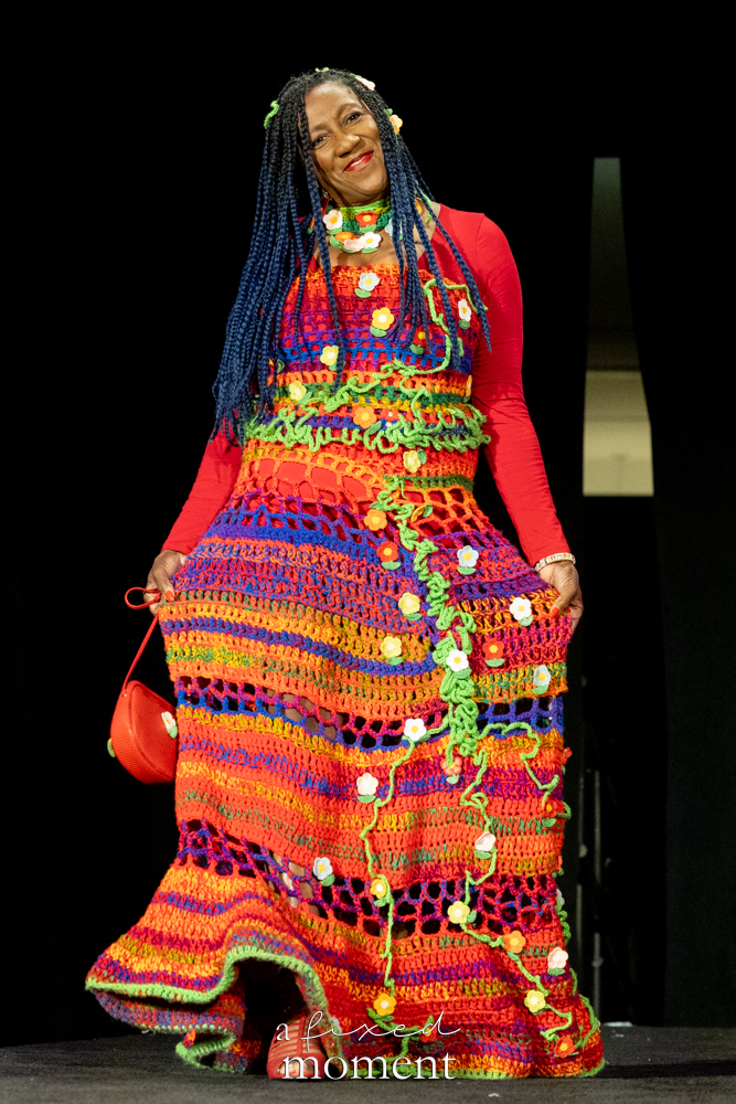 Participant in a colorful crochet floral runway look at Brooklyn's 2026 People's Ball