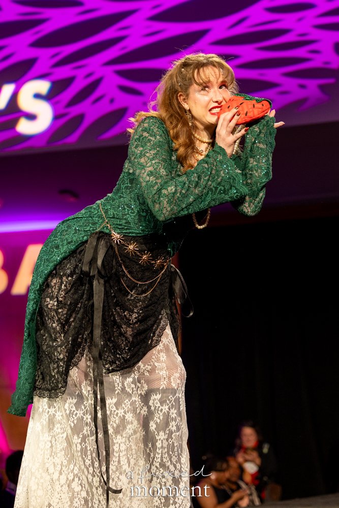 Participant in a green lace and watermelon-inspired runway look at Brooklyn's 2026 People's Ball