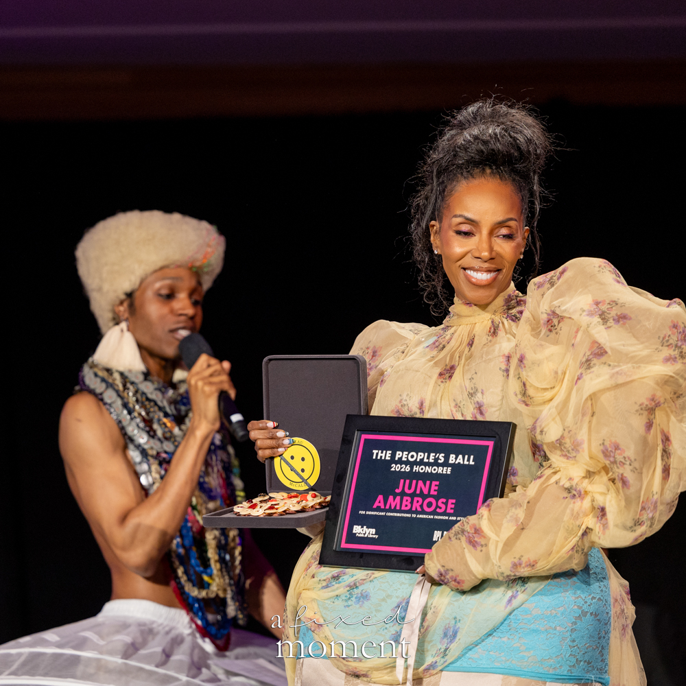 June Ambrose holds her People's Ball 2026 honoree award as Souleo speaks beside her