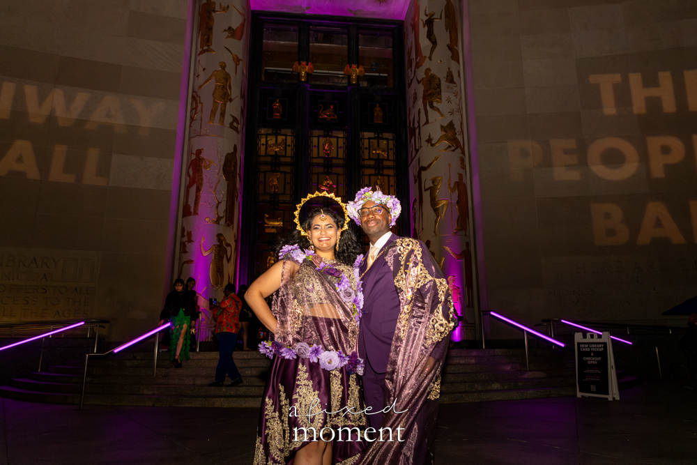 @somesayimmodest and @marvelous_miss_nish pose near the library entrance at Brooklyn's 2026 People's Ball