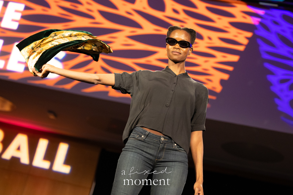 Participant in sunglasses with sweeping fabric on the runway at Brooklyn's 2026 People's Ball
