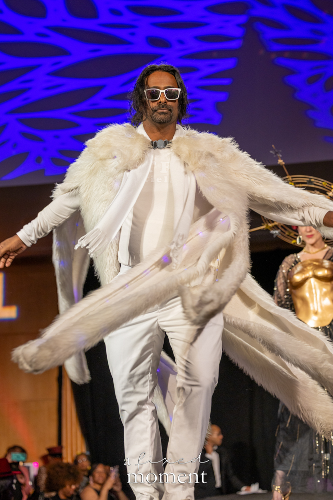 Participant in a white fur cape runway look at Brooklyn's 2026 People's Ball