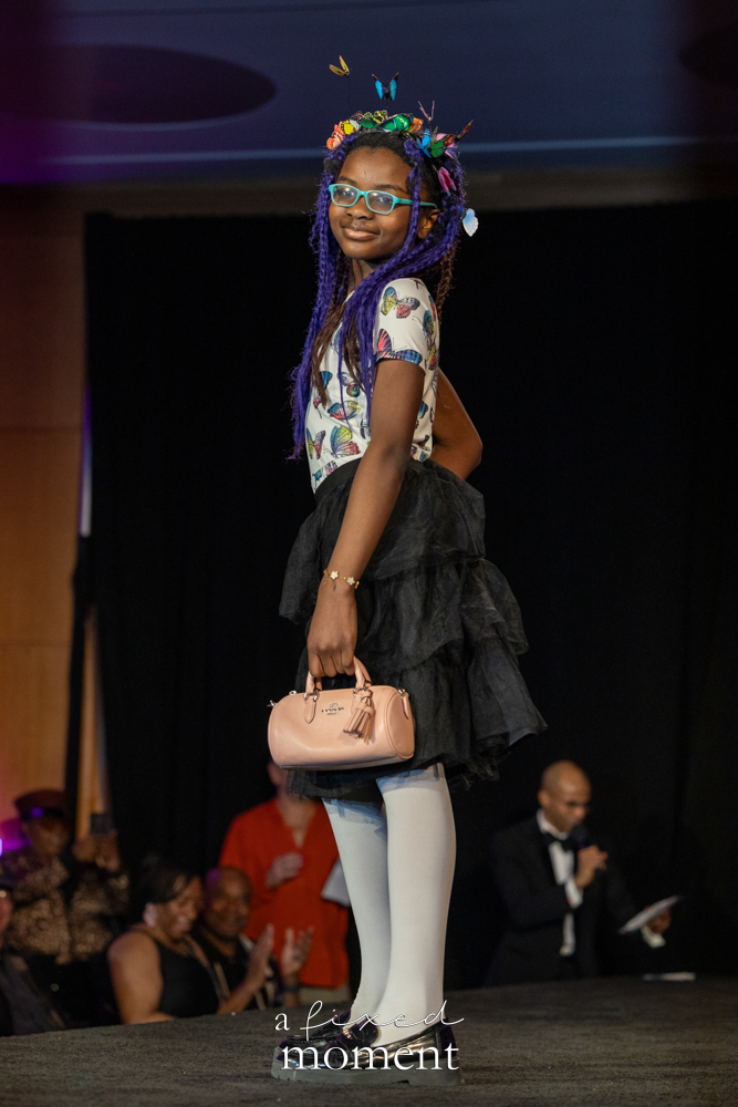 Young participant in a butterfly-inspired runway look at Brooklyn's 2026 People's Ball