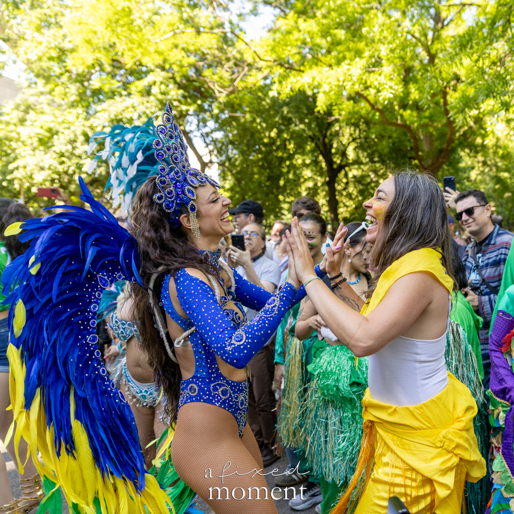 @sambanewyork dancer high-fives the crowd during Dance Parade NYC 2026