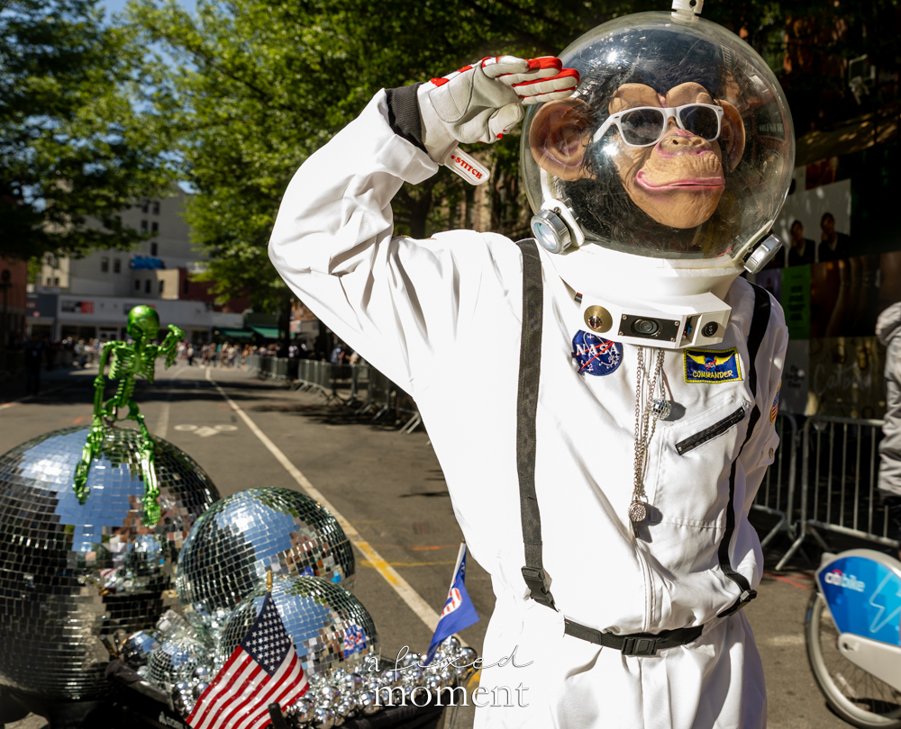 @spacemonkeynyc astronaut monkey performer with disco ball details during Dance Parade NYC 2026