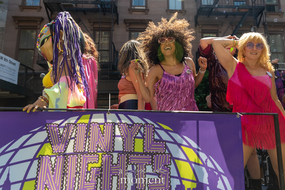 @vinylnights_ and Xanadu float performers with banner during Dance Parade NYC 2026