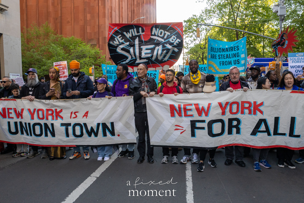 Marchers carry union banners during the May Day Protest near Foley Square in New York City on May 1, 2026