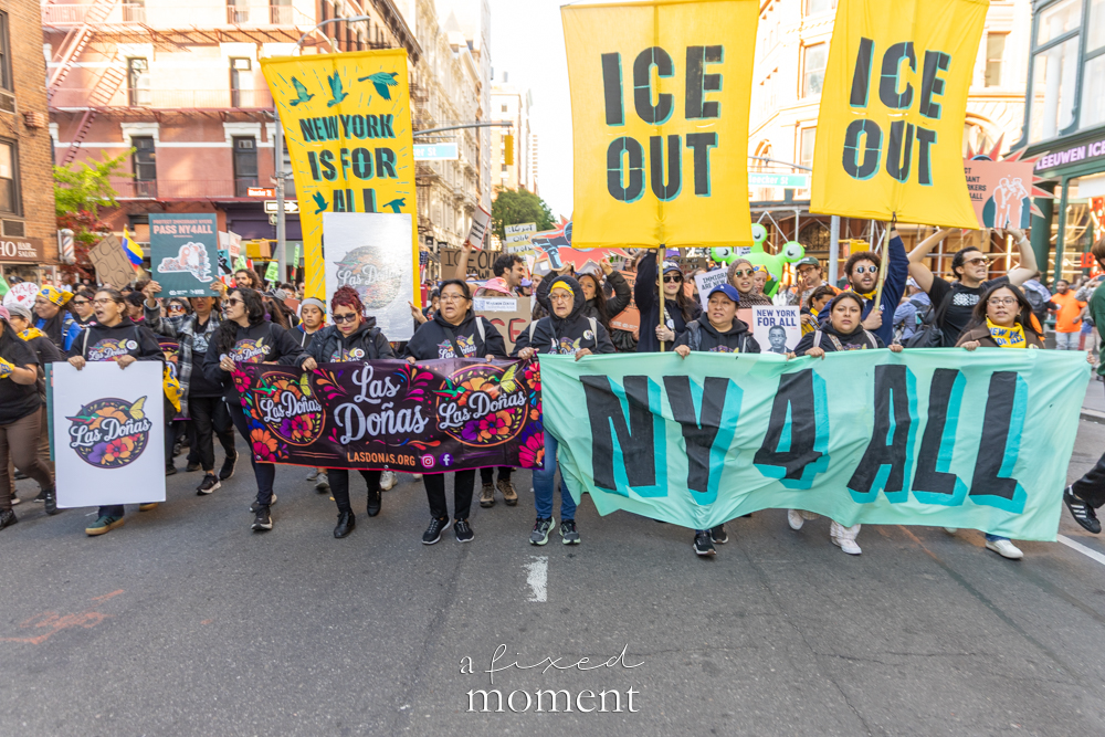 Las Doñas and NY4All march with ICE Out signs
