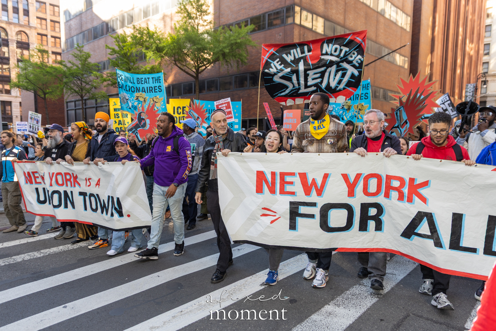 Marchers carry New York is a union town and New York for all banners during the May Day Protest in New York City on May 1, 2026