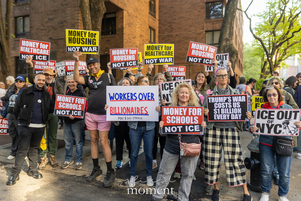Protesters hold Workers Over Billionaires and ICE Out signs during the May Day Protest in New York City on May 1, 2026