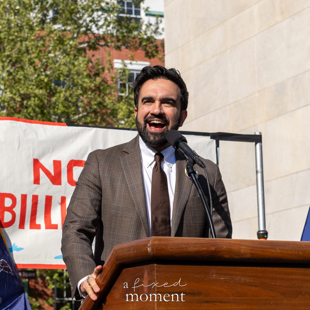 Mayor Zohran Mamdani speaks at a podium during the May Day Protest
