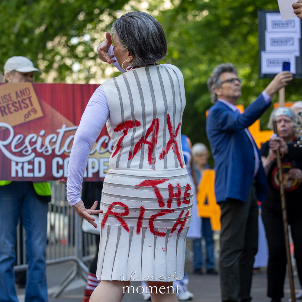 Participant wears a Tax the Rich costume during the Resistance Red Carpet outside the Met Gala