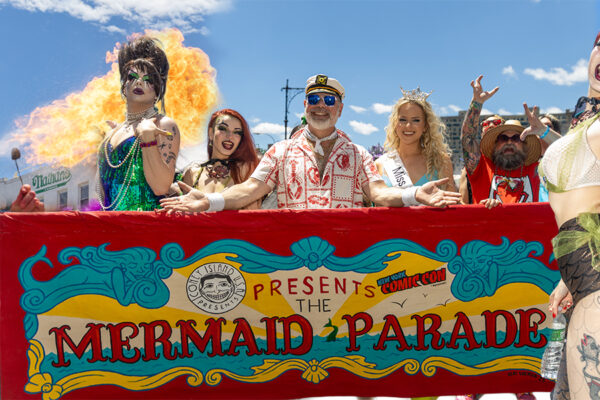 Fire performer @kingtitanyc breathes fire outside Nathan’s Famous during the 44th Annual Mermaid Parade in Coney Island, Brooklyn.