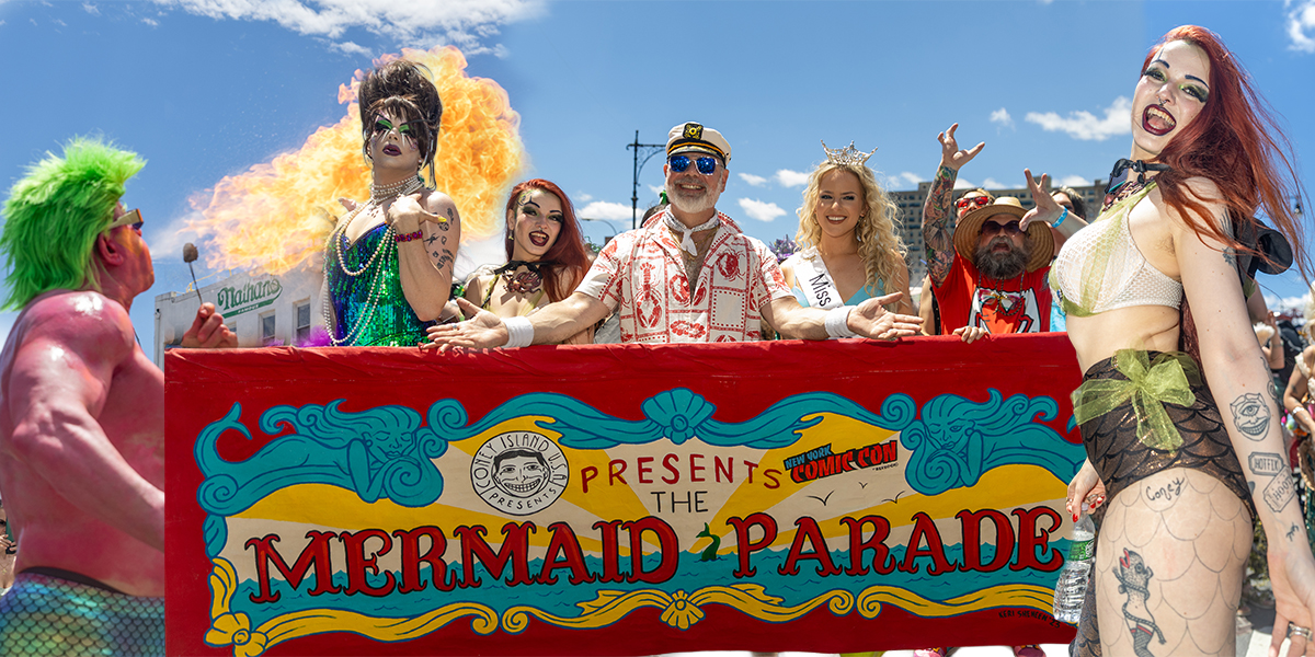 Fire performer @kingtitanyc breathes fire outside Nathan’s Famous during the 44th Annual Mermaid Parade in Coney Island, Brooklyn.