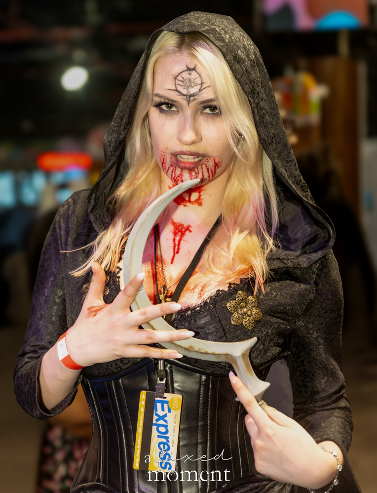@dryadaddie in a gothic horror scythe cosplay at Brooklyn Comic Con 2026