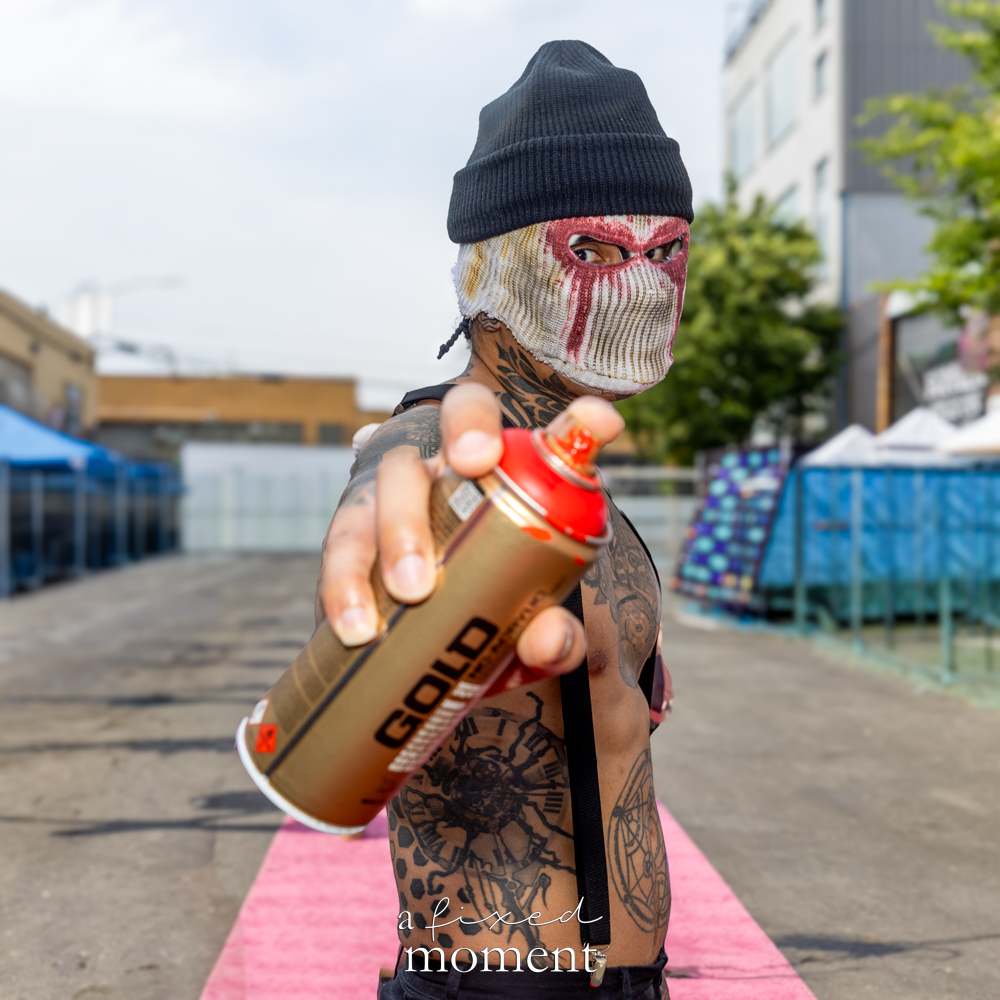 @prettydang3rous in a masked spray can cosplay at Brooklyn Comic Con 2026