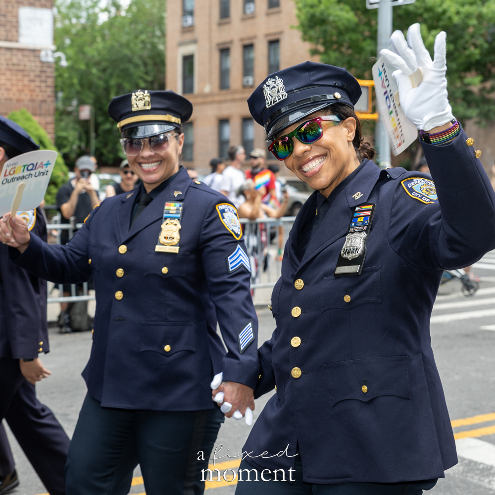 NYPD LGBTQIA+ Outreach officers march during Queens Pride.